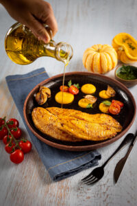 Tilapia Carapreta com creme de abóbora e pesto.